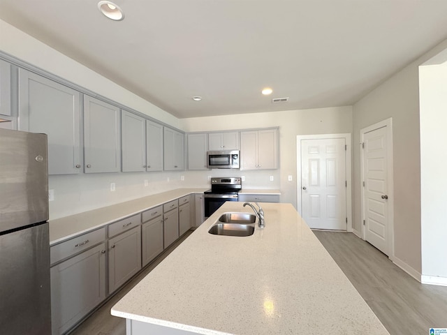 115 Ridgeview Cir, Jemison, AL 35085 - kitchen with appliances with stainless steel finishes, gray cabinets, a sink, recessed lighting, and light stone countertops