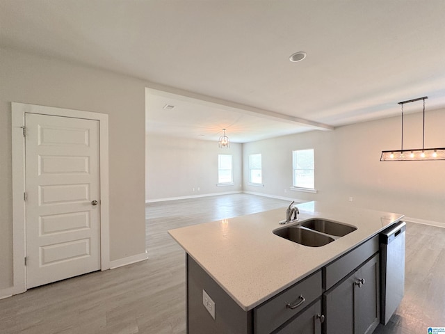 115 Ridgeview Cir, Jemison, AL 35085 - kitchen featuring a sink, stainless steel dishwasher, a kitchen island with sink, light wood-style flooring, and decorative light fixtures
