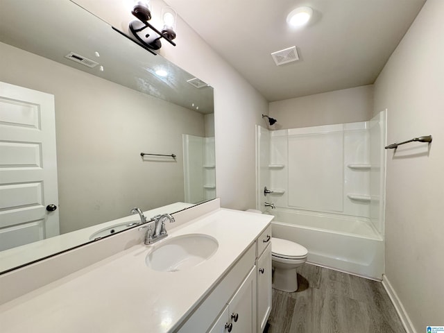 115 Ridgeview Cir, Jemison, AL 35085 - bathroom with wood finished floors, toilet, vanity,  shower combination, and baseboards