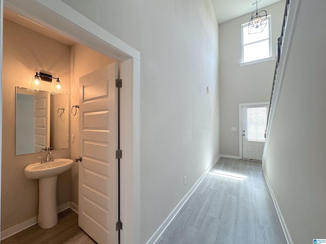 115 Ridgeview Cir, Jemison, AL 35085 - hallway with light wood-style floors, a sink, and baseboards