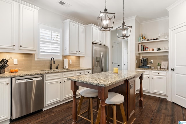 2982 Kelham Grove Way, Birmingham, AL 35242 - kitchen featuring appliances with stainless steel finishes, a sink, white cabinets, dark wood-type flooring, and tasteful backsplash