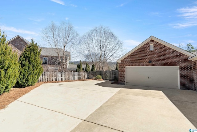 2982 Kelham Grove Way, Birmingham, AL 35242 - view of side of property with brick siding, concrete driveway, and a garage