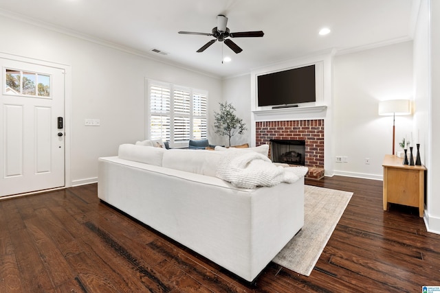 2982 Kelham Grove Way, Birmingham, AL 35242 - living room featuring ornamental molding, dark wood-style flooring, ceiling fan, a brick fireplace, and baseboards