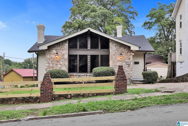 809 15th St W, Birmingham, AL 35208 - mid-century modern home featuring a chimney, stone siding, and a shingled roof