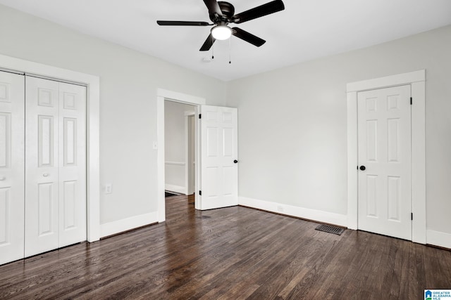 809 15th St W, Birmingham, AL 35208 - unfurnished bedroom featuring wood finished floors, baseboards, a closet, and a ceiling fan