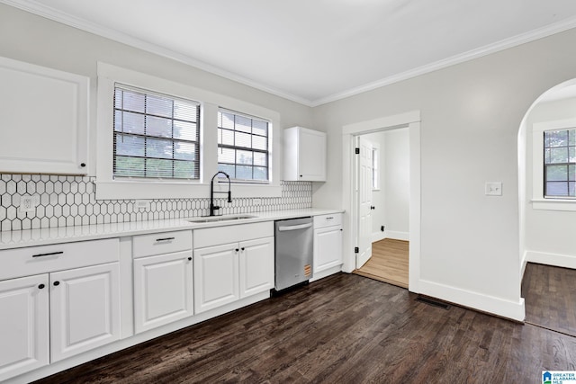 809 15th St W, Birmingham, AL 35208 - kitchen featuring dishwasher, a sink, arched walkways, decorative backsplash, and crown molding