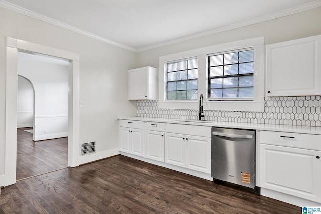 809 15th St W, Birmingham, AL 35208 - kitchen with stainless steel dishwasher, a sink, crown molding, light countertops, and backsplash