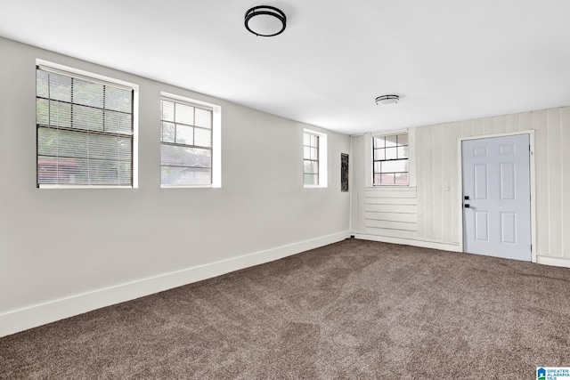 809 15th St W, Birmingham, AL 35208 - spare room with dark carpet, baseboards, and healthy amount of natural light
