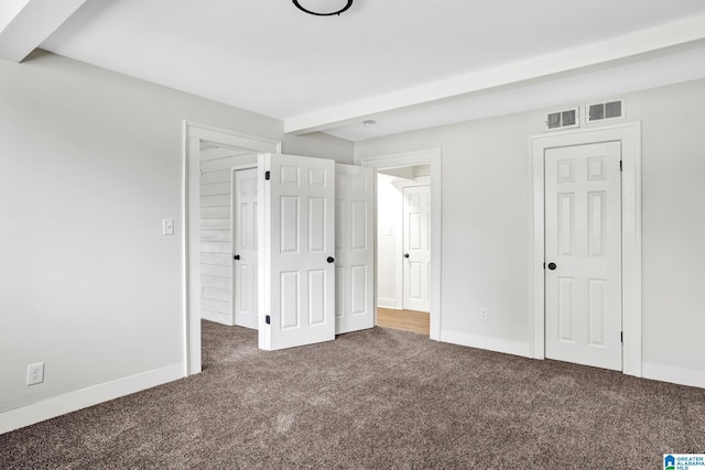 809 15th St W, Birmingham, AL 35208 - unfurnished bedroom featuring carpet flooring, beamed ceiling, and baseboards