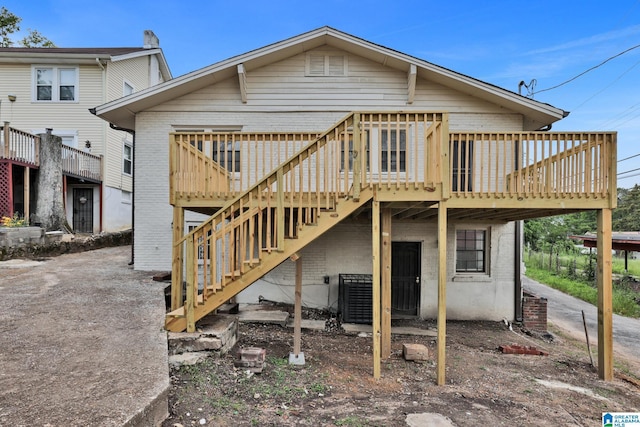 809 15th St W, Birmingham, AL 35208 - back of house featuring a wooden deck and brick siding