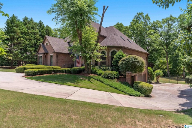 1272 Highland Lakes Trl, Birmingham, AL 35242 - view of front of home featuring brick siding, driveway, a front yard, and an attached garage