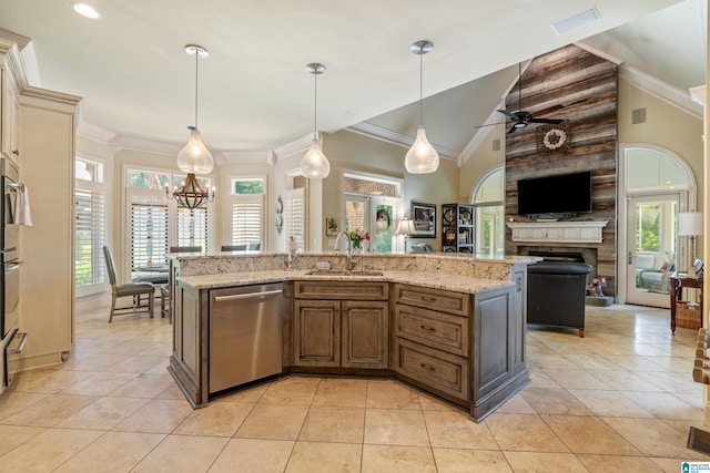 1272 Highland Lakes Trl, Birmingham, AL 35242 - kitchen with appliances with stainless steel finishes, a sink, open floor plan, a ceiling fan, and a fireplace
