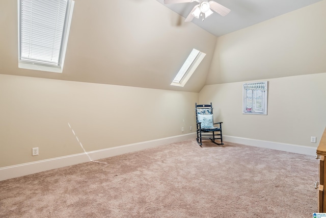 1272 Highland Lakes Trl, Birmingham, AL 35242 - unfurnished room with vaulted ceiling, carpet, a skylight, a ceiling fan, and baseboards