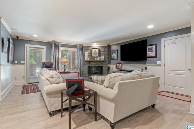 1272 Highland Lakes Trl, Birmingham, AL 35242 - living room featuring ornamental molding, a fireplace, wainscoting, recessed lighting, and light wood-style flooring