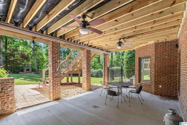 1272 Highland Lakes Trl, Birmingham, AL 35242 - view of patio / terrace featuring a ceiling fan, stairway, outdoor dining area, and view of scattered trees