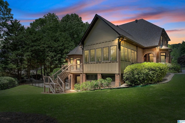 1272 Highland Lakes Trl, Birmingham, AL 35242 - back of house featuring stairway, a sunroom, brick siding, and roof with shingles