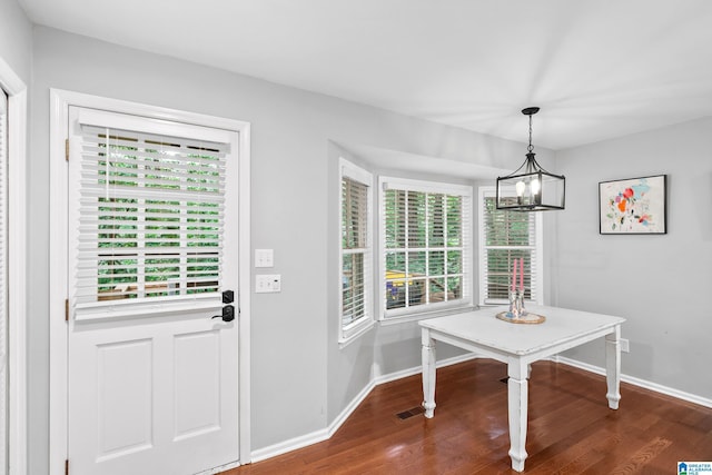 2013 Crossvine Rd, Hoover, AL 35244 - unfurnished dining area with healthy amount of natural light, dark wood-style floors, and baseboards