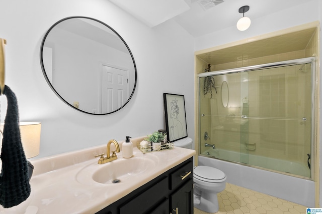 2013 Crossvine Rd, Hoover, AL 35244 - bathroom featuring toilet, vanity, shower / bath combination with glass door, and tile patterned floors