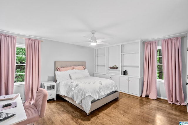 2013 Crossvine Rd, Hoover, AL 35244 - bedroom with multiple windows, wood finished floors, and ceiling fan
