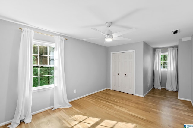 2013 Crossvine Rd, Hoover, AL 35244 - unfurnished bedroom featuring light wood-style floors, baseboards, a closet, and a ceiling fan