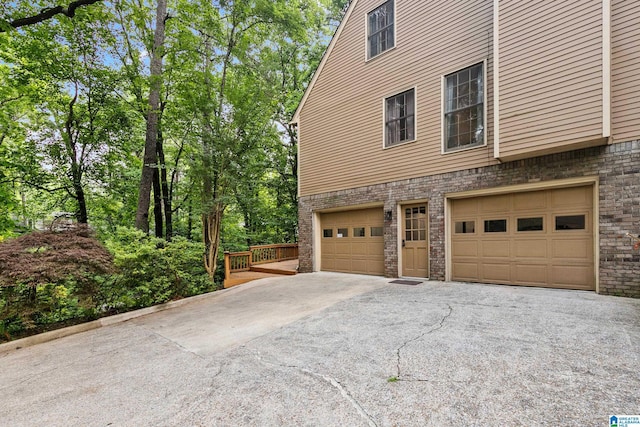 2013 Crossvine Rd, Hoover, AL 35244 - view of home's exterior with an attached garage and asphalt driveway