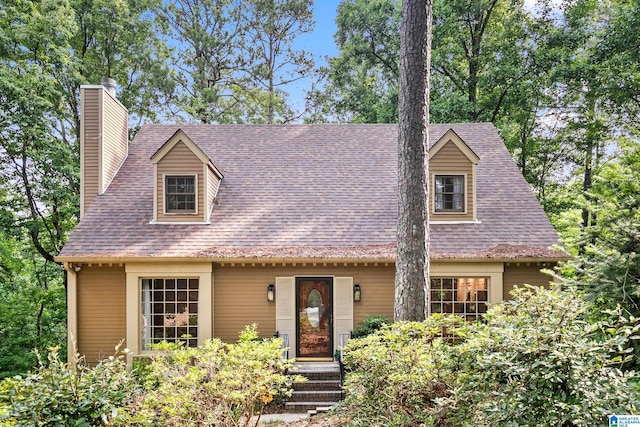 2013 Crossvine Rd, Hoover, AL 35244 - view of front facade featuring a chimney and roof with shingles