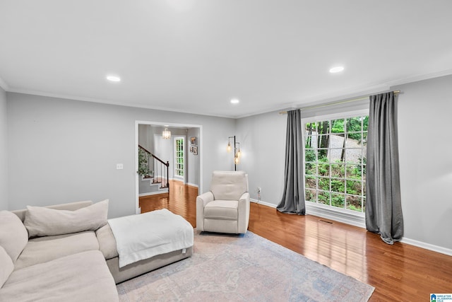 2013 Crossvine Rd, Hoover, AL 35244 - living room with stairway, ornamental molding, wood finished floors, baseboards, and recessed lighting