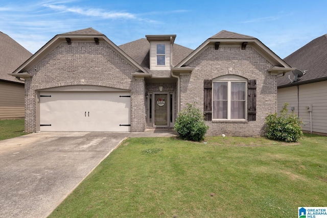 2304 Spaulding Pl, Moody, AL 35004 - french country home with brick siding, a garage, concrete driveway, a front lawn, and a shingled roof
