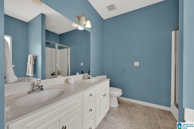 2304 Spaulding Pl, Moody, AL 35004 - full bath featuring a stall shower, toilet, double vanity, baseboards, and tile patterned floors