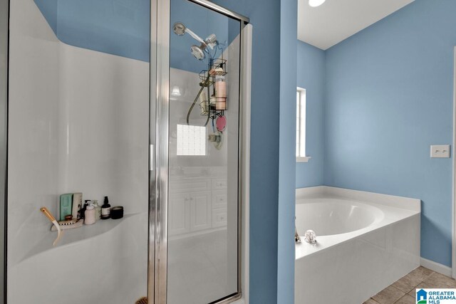 2304 Spaulding Pl, Moody, AL 35004 - bathroom featuring a stall shower, a garden tub, and tile patterned flooring