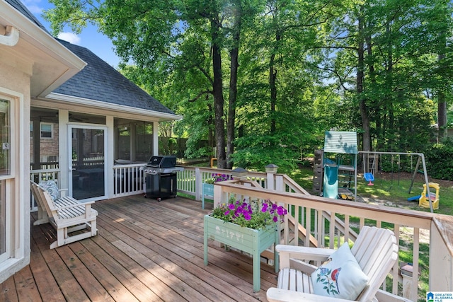 3709 Carisbrooke Dr, Hoover, AL 35226 - wooden terrace featuring a grill, a sunroom, and a playground