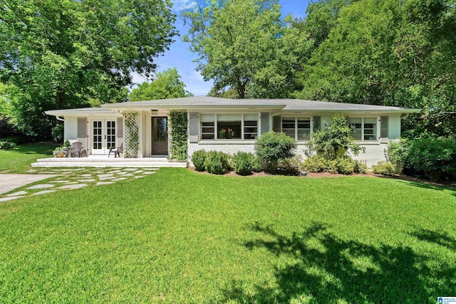 2121 Vestaview Cir, Vestavia Hills, AL 35216 - ranch-style home with french doors, a front yard, and brick siding