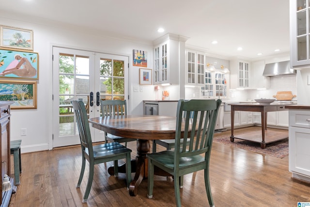409 Euclid Ave, Mountain Brook, AL 35213 - dining space featuring french doors, wood finished floors, recessed lighting, baseboards, and crown molding