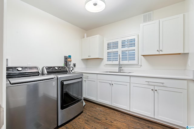 409 Euclid Ave, Mountain Brook, AL 35213 - laundry room featuring independent washer and dryer, cabinet space, and dark wood-style floors