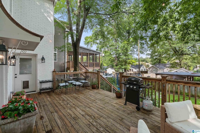 409 Euclid Ave, Mountain Brook, AL 35213 - wooden terrace featuring a sunroom and a grill