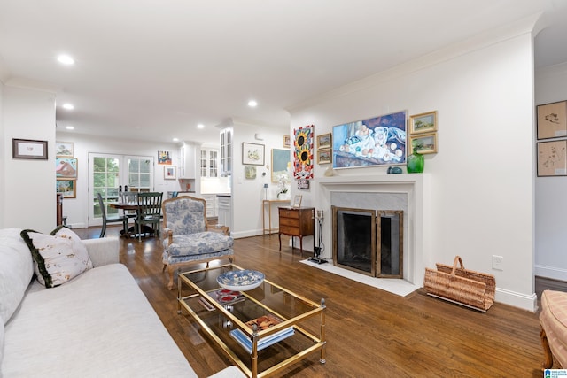 409 Euclid Ave, Mountain Brook, AL 35213 - living room featuring recessed lighting, wood finished floors, baseboards, ornamental molding, and a fireplace with flush hearth