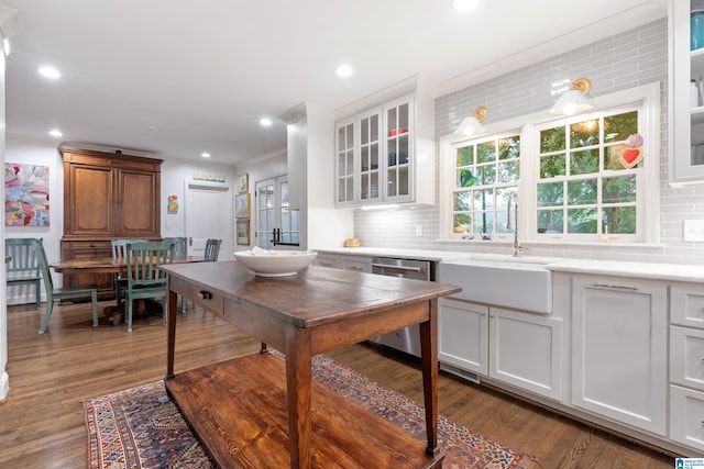 409 Euclid Ave, Mountain Brook, AL 35213 - kitchen featuring stainless steel dishwasher, a sink, decorative backsplash, light countertops, and recessed lighting