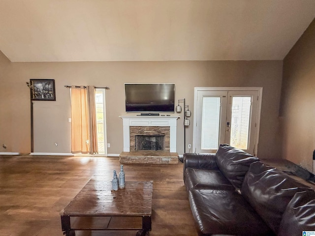184 Raptor Way, Anniston, AL 36207 - living room with wood finished floors, a stone fireplace, and baseboards