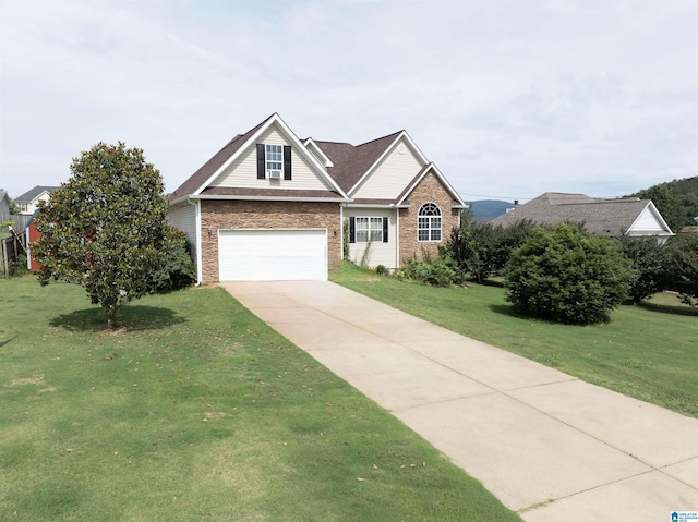 184 Raptor Way, Anniston, AL 36207 - traditional-style house with a front lawn, driveway, and brick siding