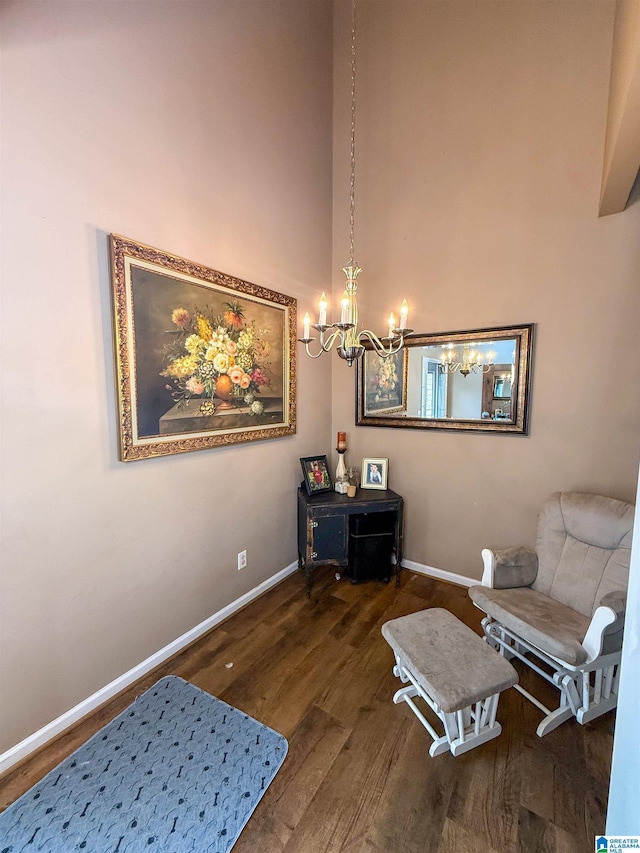 184 Raptor Way, Anniston, AL 36207 - sitting room featuring wood finished floors, a chandelier, and baseboards