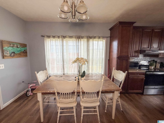 184 Raptor Way, Anniston, AL 36207 - dining area featuring dark wood finished floors, a chandelier, and baseboards