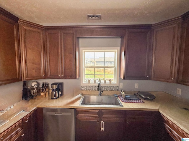 184 Raptor Way, Anniston, AL 36207 - kitchen with stainless steel dishwasher, a sink, and light countertops