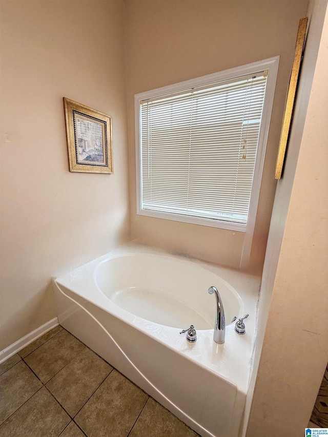 184 Raptor Way, Anniston, AL 36207 - full bathroom with tile patterned flooring, a garden tub, healthy amount of natural light, and baseboards