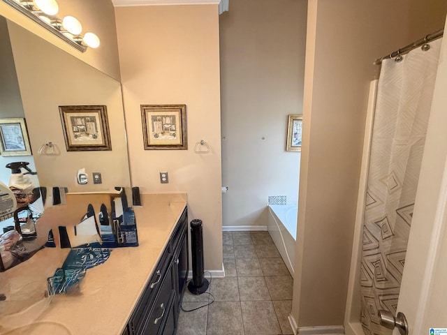 184 Raptor Way, Anniston, AL 36207 - bathroom featuring vanity, a bath, tile patterned floors, and baseboards