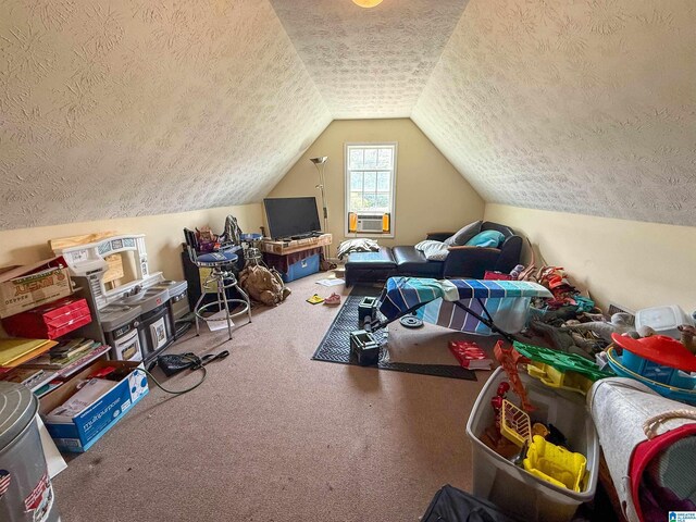 184 Raptor Way, Anniston, AL 36207 - additional living space featuring a textured ceiling, carpet floors, vaulted ceiling, and cooling unit