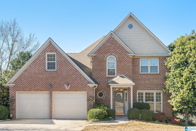 2273 Sterling Ridge Cir, Vestavia Hills, AL 35216 - view of front facade with brick siding, concrete driveway, roof with shingles, and an attached garage
