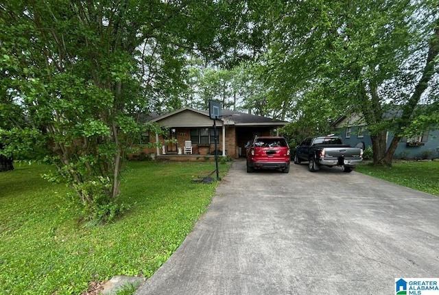 409 Morningview St, Athens, AL 35611 - view of front of house with a front yard, driveway, brick siding, and a porch
