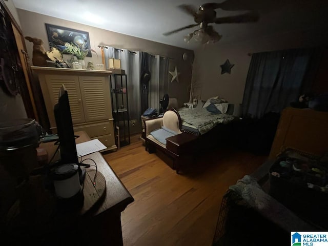 409 Morningview St, Athens, AL 35611 - bedroom with wood finished floors, ceiling fan, and an office area