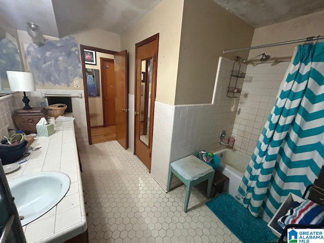 409 Morningview St, Athens, AL 35611 - bathroom featuring tile walls, wainscoting, double vanity, and shower / bathtub combination with curtain