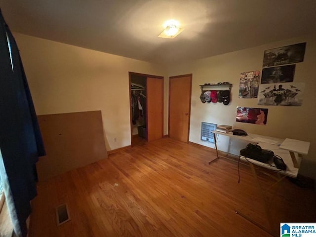 409 Morningview St, Athens, AL 35611 - bedroom with wood finished floors, a closet, and baseboards